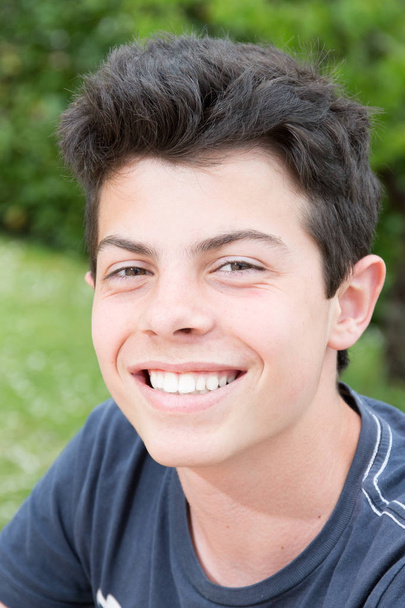 Portrait Of Young Smiling Teen Boy outdoor spring day - Fotografie, Obrázek