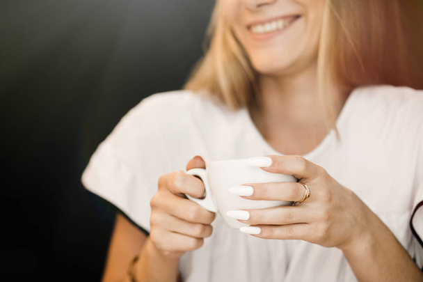 Woman with cup of hot coffee drink - Photo, Image