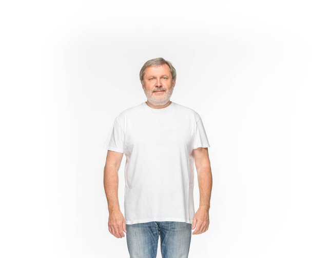 Closeup of senior mans body in empty white t-shirt isolated on white background. Mock up for disign concept - Foto, Bild