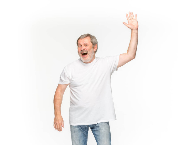 Closeup of senior mans body in empty white t-shirt isolated on white background. Mock up for disign concept - Foto, immagini