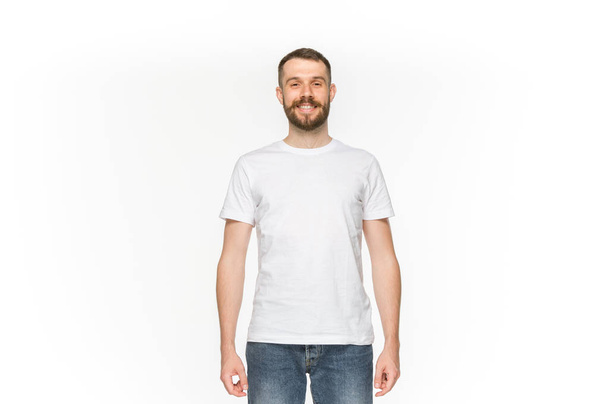 Closeup of young mans body in empty white t-shirt isolated on white background. Mock up for disign concept - Foto, Imagem