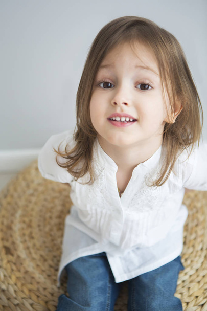 Portrait of the happy little cute girl a on white background  - Fotografie, Obrázek