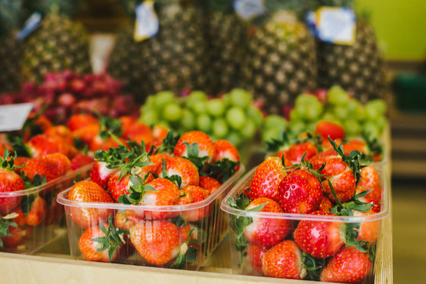 Close up of strawberries in packing at showcase in supermarket - Zdjęcie, obraz