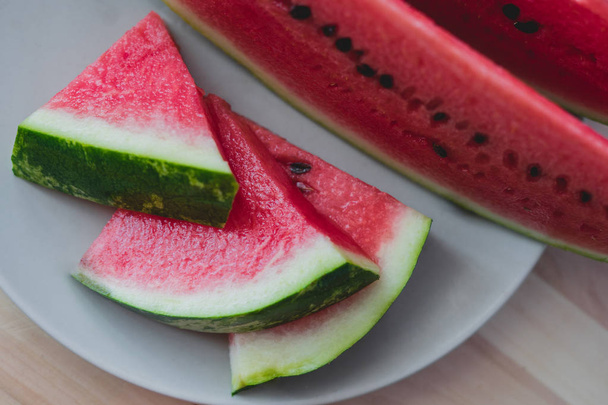 Sliced fresh watermelon on wooden background closeup - Photo, Image