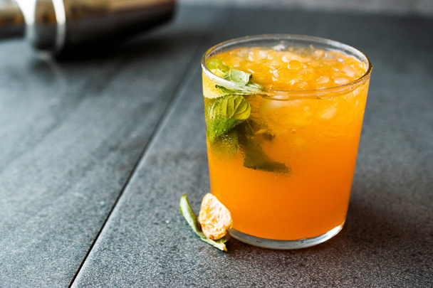 Mandarin Mojito Cocktail with Mint Leaves and Crushed Ice / Tangerine or Clementine. Summer Beverage - Fotó, kép