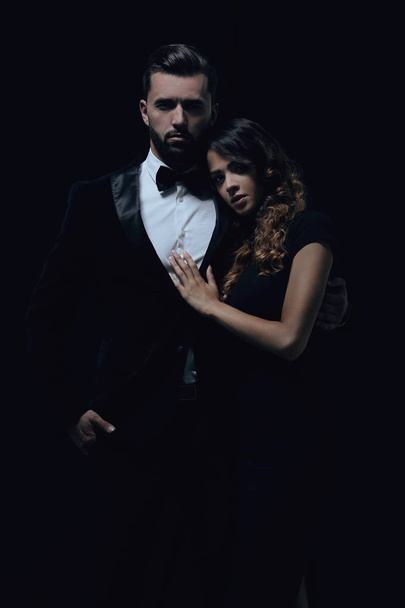 portrait of fashion couple on black background - Photo, image