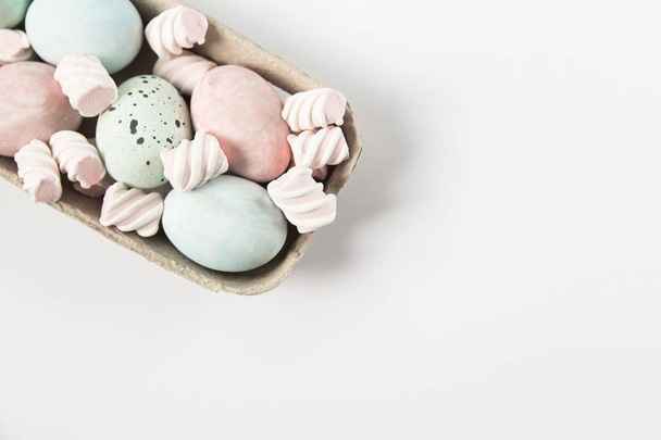 Easter hand painted eggs and marshmallow.White background.Copy space. - Valokuva, kuva