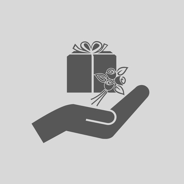 gift and hand vector icon - Vector, Image