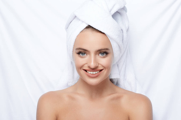 beautiful and natural young woman with turban towel on head, skin care, hydrated skin, treatment concept  - Zdjęcie, obraz