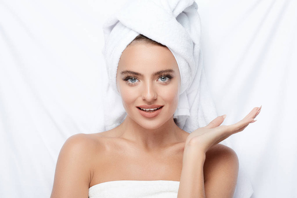 beautiful and natural young woman with turban towel on head, skin care, hydrated skin, treatment concept  - Foto, immagini
