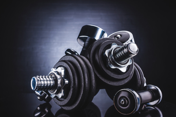 close-up view of various dumbbells, sport and healthy lifestyle concept  - Photo, Image