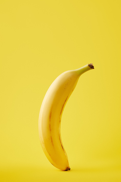 close up view of fresh banana isolated on yellow - Zdjęcie, obraz