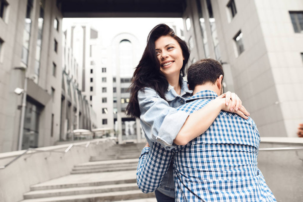 Love story. Guy in plaid shirt hugs girl. Romantic couple. - Fotografie, Obrázek