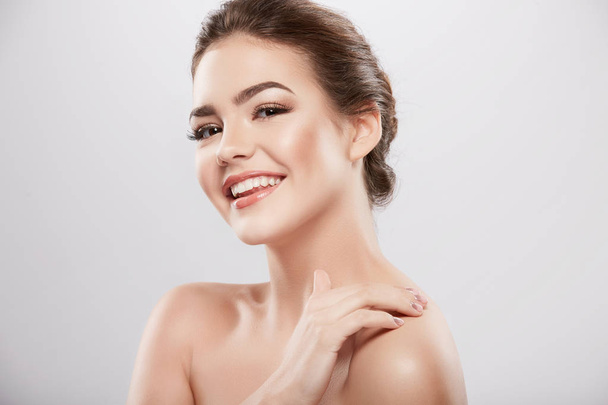 beauty portrait of happy woman posing at grey background,  skin care and hydrated skin, concept  - Photo, Image