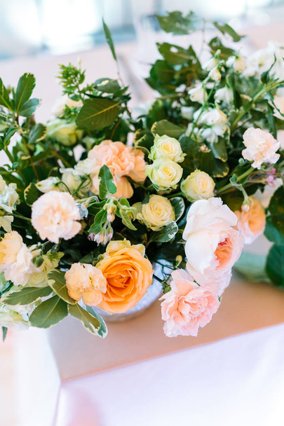 relationships, love, wedding concept. close up of big bouquet composed of beautiful avalanches and wonderful roses decorated with leaves of rosebush and raspberry - Φωτογραφία, εικόνα