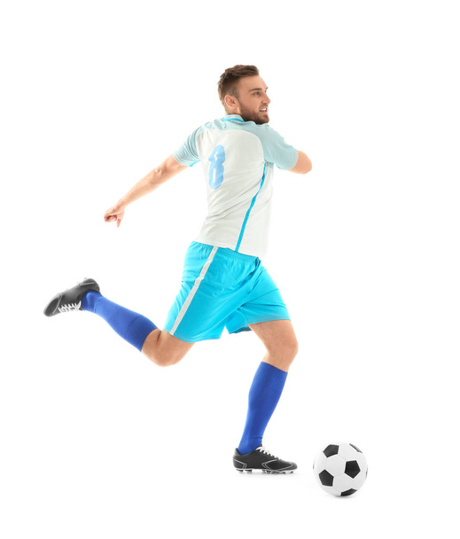 Young man playing football on white background - Foto, Imagen