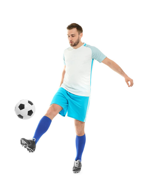 Young man playing football on white background - Fotografie, Obrázek
