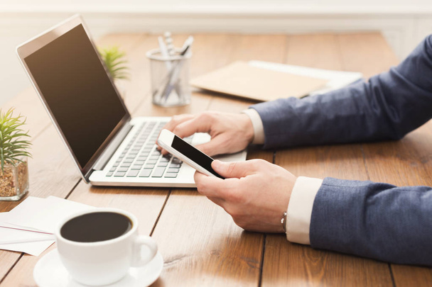 Unrecognizable businessman typing on laptop - Photo, Image