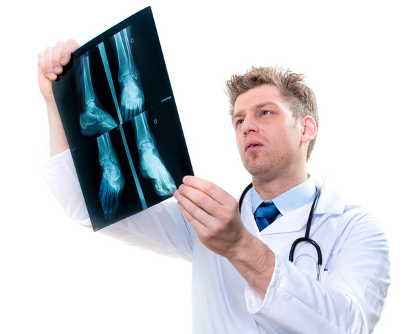 cheerful doctor examining feet x-ray - Foto, Imagem