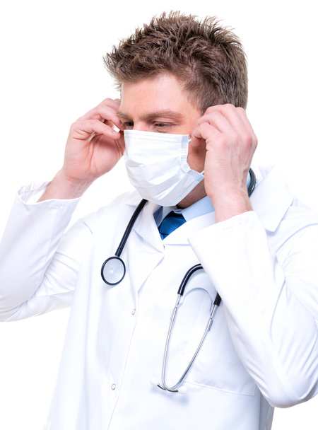 Cherfull doctor wearing surgical mask and stethoscope - Photo, image