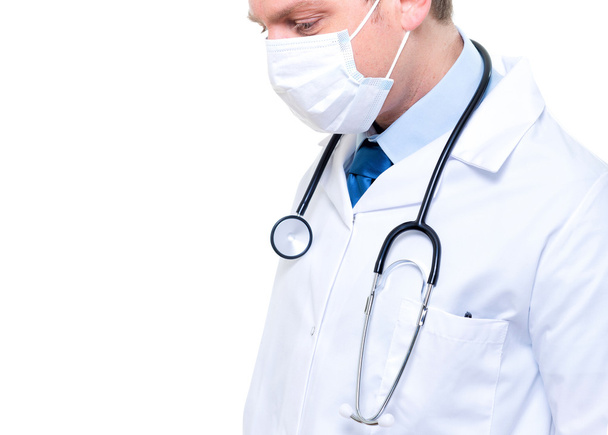 Portrait of male doctor wearing surgical mask - Фото, изображение