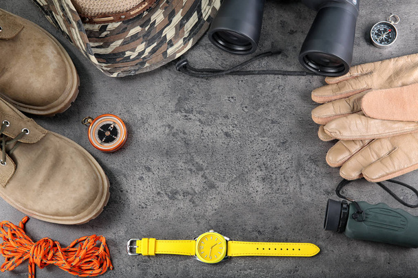 Flat lay composition with camping equipment on grey background - 写真・画像
