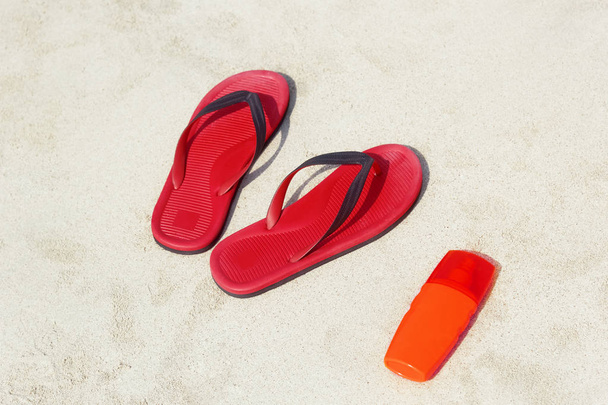 Flip flops on a sandy ocean beach - Photo, image