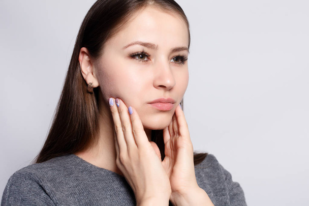 health, people, Dental and lifestyle concept - Teeth Problem. Woman Feeling Tooth Pain. Closeup Of Beautiful Sad Girl Suffering From Strong Tooth Pain. Attractive Female Feeling Painful Toothache - Fotó, kép