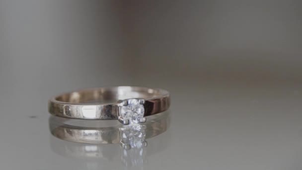 Wedding rings on a homogeneous background - Footage, Video