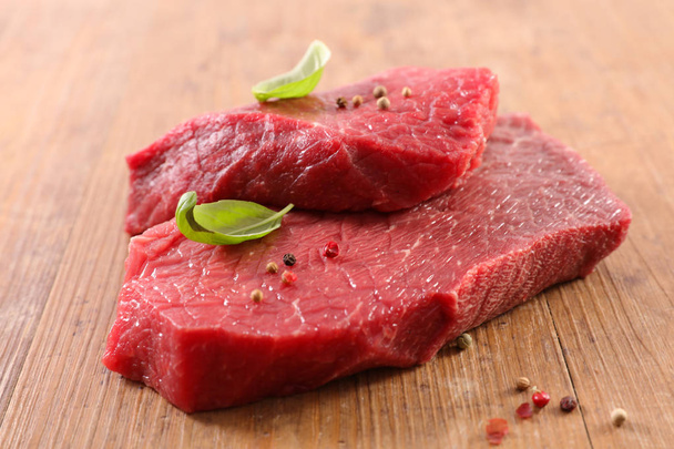 raw piece of beef on wooden board - Photo, Image