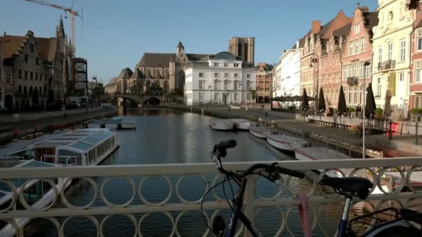 Camera slides over bicycle on Grasbrug Bridge to reveal the Leie Canal and houses on Korenlei  - Footage, Video