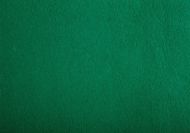 Poker tafel vilt achtergrond in groene kleur - Foto, afbeelding