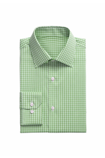 Une chemise homme pliée à carreaux vert isolé sur un fond blanc
 - Photo, image