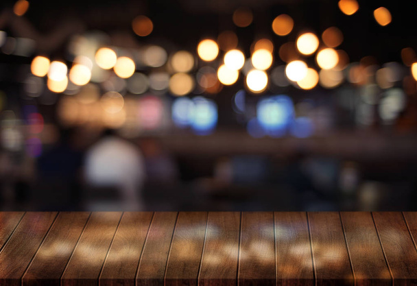 Wooden board empty table  cafe, coffee shop, bar blurred background can be used for display or montage your products and Mock up - 写真・画像