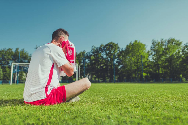 Crying Polish Football Fan After Lost Match. European Soccer Mundial Theme. Polish National Team Colors Wearing. - Φωτογραφία, εικόνα