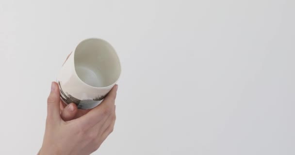 Human shows beautiful mug - Footage, Video