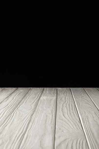 white striped wooden tabletop on black - Foto, Bild