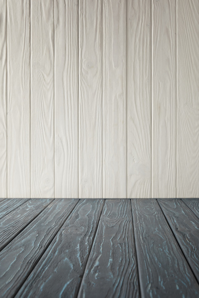 grey striped tabletop and white wooden wall - Foto, Imagem