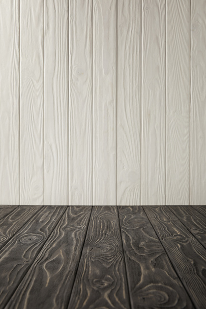 dark grey wooden tabletop and white wooden wall - Φωτογραφία, εικόνα