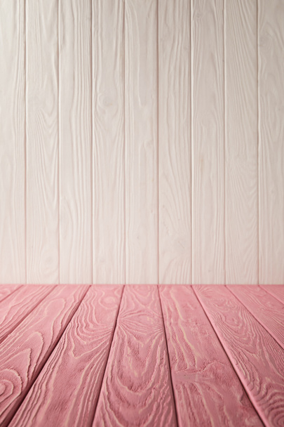 pink striped tabletop and white wooden wall - Photo, Image