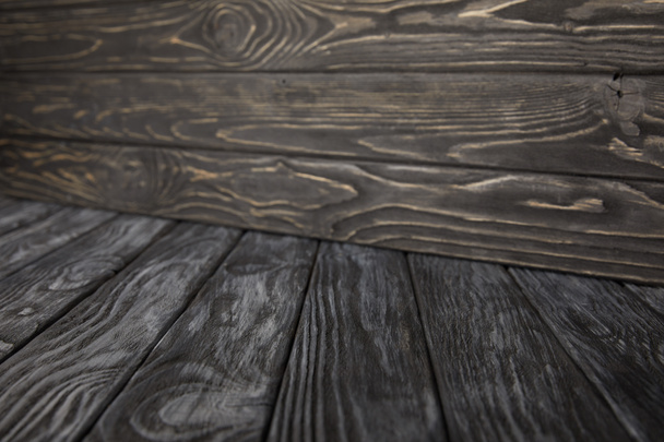 dark grey wooden floor and dark brown wooden wall - Valokuva, kuva