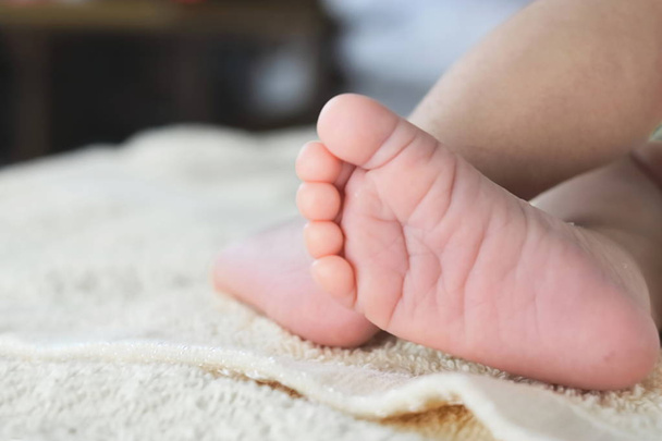 Soft focus of newborn tiny baby feet with copy space background. - Photo, Image