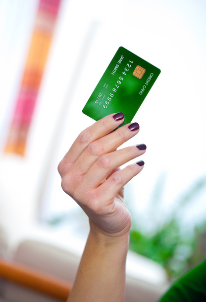 Кредитна картка в руці
 - Фото, зображення