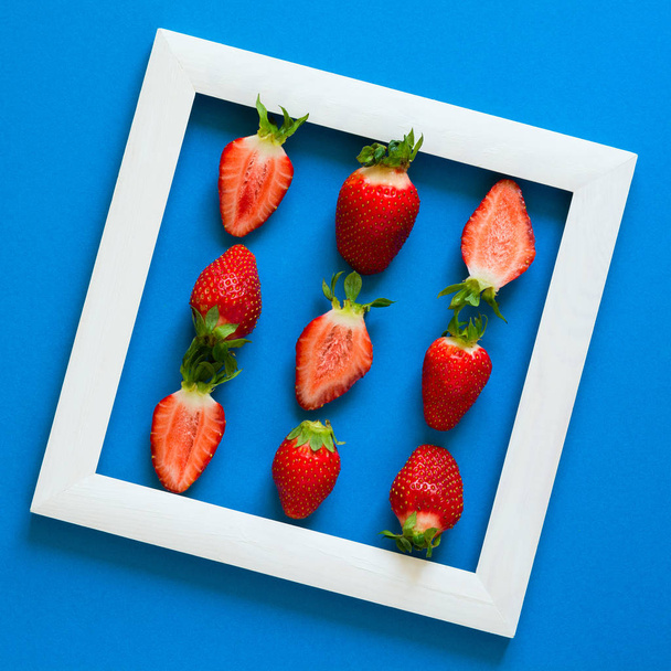 Minimalism. Strawberry martix. Masterpiece in wooden frame. Top view. Flat lay. - Fotó, kép