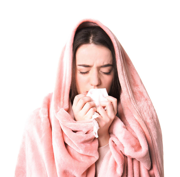 Young woman with cold sneezing on white background - Foto, Bild