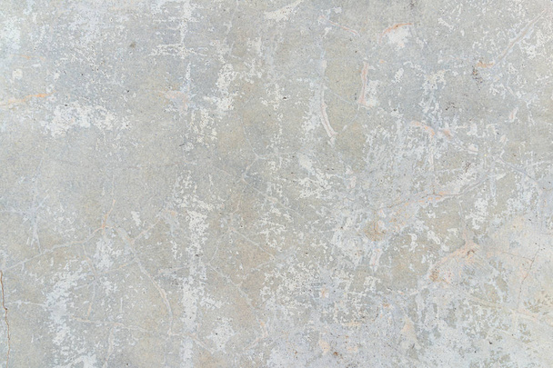 Closeup fragment of grunge weathered wall of a building, Aged cracked concrete stone plaster wall background and texture style - Photo, Image
