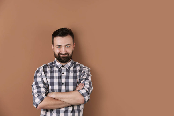 Portrait of handsome bearded man on color background - Photo, Image