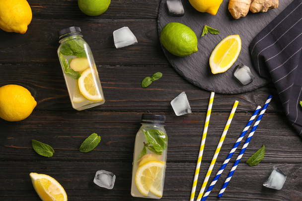 Flat lay composition with detox lemonade and ingredients on wooden background - Zdjęcie, obraz