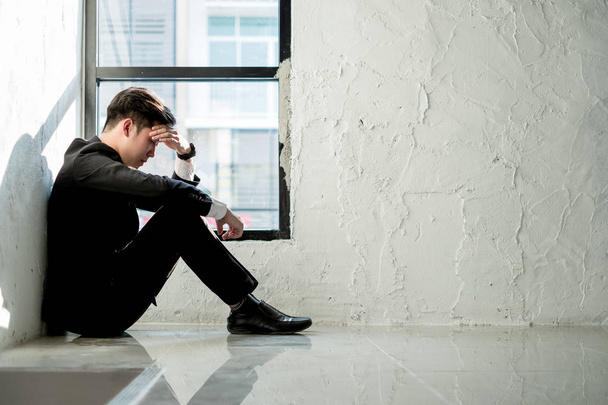 young business man sitting in office feeling tired and stressed, business concept - 写真・画像