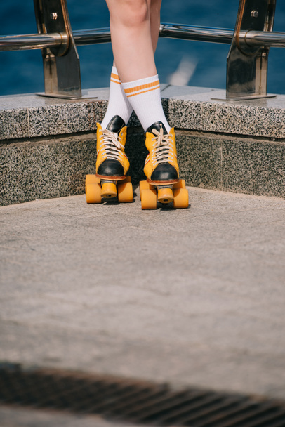 cropped shot of girl in socks and vintage roller skates standing on street - Photo, Image